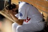 Los Angeles Dodgers pitcher Clayton Kershaw sits in the dugout after giving up back-to-back home runs to the Washington Nationals during the eighth inning in Game 5 of a baseball National League Division Series on Wednesday, Oct. 9, 2019, in Los Angeles. (AP Photo/Marcio Jose Sanchez)