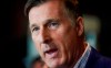 People's Party of Canada leader Maxime Bernier speaks at a news conference at the 3 Brasseurs restaurant in Quebec City on Friday, October 18, 2019. THE CANADIAN PRESS/Mathieu Belanger