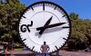 In this Thursday, July 25, 2019 photo, workers at the Electric Time Company in Medfield, Mass., test a 20 foot high clock, built for the a new train station in Bangkok, Thailand, prior to packing and shipment. The clock features a 