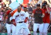Boston Red Sox's Mookie Betts is doused by teammates after drawing a game-ending walk that gave the team a 4-3 win against the Texas Rangers in a baseball game at Fenway Park, Wednesday, June 12, 2019, in Boston. (AP Photo/Elise Amendola)