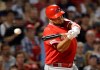 Los Angeles Angels' Albert Pujols swings and misses at a pitch from Boston Red Sox starting pitcher Chris Sale during the seventh inning of a baseball game at Fenway Park, Thursday, Aug. 8, 2019, in Boston. (AP Photo/Elise Amendola)