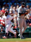 Seattle Mariners' Roenis Elias, right, walks back to the mound after giving up a three-run home run to Boston Red Sox's Sandy Leon, left, during the third inning of a baseball game in Boston, Saturday, May 11, 2019. (AP Photo/Michael Dwyer)