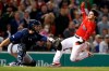 Boston Red Sox's Andrew Benintendi, right, scores on a double by Mitch Moreland as Seattle Mariners' Tom Murphy gets the throw during the fifth inning of a baseball game in Boston, Friday, May 10, 2019. (AP Photo/Michael Dwyer)