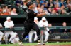 Baltimore Orioles' Pedro Severino follows though on a grand slam against the Tampa Bay Rays during the third inning of a baseball game Saturday, Aug. 24, 2019, in Baltimore. (AP Photo/Gail Burton)