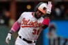 Baltimore Orioles' Dwight Smith Jr. pats his helmet while rounding third on his two-run home run against the Los Angeles Angels in the third inning of a baseball game, Sunday, May 12, 2019, in Baltimore. (AP Photo/Gail Burton)