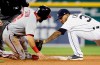Washington Nationals' Adam Eaton (2) is tagged out by second baseman Detroit Tigers' Harold Castro (30) while trying to advance to second base on a fly out by Anthony Rendon during the eighth inning of a baseball game Friday, June 28, 2019, in Detroit. (AP Photo/Duane Burleson)