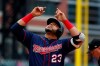 Minnesota Twins' Nelson Cruz celebrates his two-run home run against the Detroit Tigers in the first inning of a baseball game in Detroit, Sunday, June 9, 2019. (AP Photo/Paul Sancya)