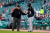 First base umpire D.J. Rayburn tells Miami Marlins pitcher Sandy Alcantara to leave the field before the first pitch of the team's baseball game against the Detroit Tigers in Detroit, Wednesday, May 22, 2019. Alcantara stood with equipment on after national anthem until he was asked to leave the field. (AP Photo/Paul Sancya)
