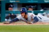 Houston Astros' George Springer slides safely into home plate for an inside-the-park home run during the fifth inning of the team's baseball game against the Detroit Tigers in Detroit, Tuesday, May 14, 2019. (AP Photo/Paul Sancya)