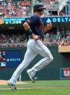 Minnesota Twins' Max Kepler jogs home to score on a Jorge Polanco double off Oakland Athletics pitcher Daniel Mengden in the first inning of a baseball game Sunday, July 21, 2019, in Minneapolis. (AP Photo/Jim Mone)