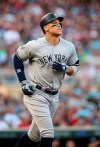 New York Yankees' Aaron Judge heads to first base after drawing a walk from Minnesota Twins pitcher Martin Perez in the first inning of a baseball game Monday, July 22, 2019, in Minneapolis. (AP Photo/Jim Mone)