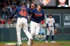 Minnesota Twins' Mitch Garver high-fives third base coach Tony Diaz after he hit a home run against the Detroit Tigers during the fourth inning of a baseball game Friday, May 10, 2019, in Minneapolis. (AP Photo/Stacy Bengs)