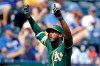 Oakland Athletics' Jurickson Profar celebrates as he crosses the plate after hitting a two-run home run during the fourth inning of a baseball game against the Kansas City Royals Thursday, Aug. 29, 2019, in Kansas City, Mo. (AP Photo/Charlie Riedel)