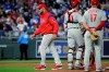 Philadelphia Phillies manager Gabe Kapler walks back to the dugout after making a pitching change during the sixth inning of the team's baseball game against the Kansas City Royals on Friday, May 10, 2019, in Kansas City, Mo. (AP Photo/Charlie Riedel)