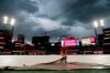Busch Stadium grounds crew member Lucas Hackmann helps pull a tarp over the field just prior to the scheduled start of a baseball game between the St. Louis Cardinals and the Cincinnati Reds on Wednesday, June 5, 2019, in St. Louis. (AP Photo/Jeff Roberson)