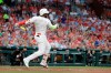 St. Louis Cardinals' Marcell Ozuna watches his two-run home run during the first inning of the team's baseball game against the Colorado Rockies on Friday, Aug. 23, 2019, in St. Louis. (AP Photo/Jeff Roberson)