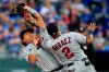 Minnesota Twins first baseman Willians Astudillo, left, is run into by third baseman Luis Arraez (2) while catching a fly ball hit by Kansas City Royals third baseman Hunter Dozier during the seventh inning of a baseball game at Kauffman Stadium in Kansas City, Mo., Saturday, Sept. 28, 2019. Minnesota Twins' Luis Arraez was injured on the play. (AP Photo/Orlin Wagner)