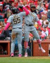 Pittsburgh Pirates' Josh Bell, left, celebrates with teammate Gregory Polanco after hitting a three-run home run during the seventh inning of a baseball game against the St. Louis Cardinals Sunday, May 12, 2019, in St. Louis. (AP Photo/Scott Kane)