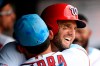Washington Nationals' Matt Adams, right, celebrates his three-run home run with Gerardo Parra, left, in the dugout during the third inning of a baseball game against the Arizona Diamondbacks, Sunday, June 16, 2019, in Washington. (AP Photo/Nick Wass)