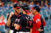 Washington Nationals starting pitcher Stephen Strasburg, left, speaks on the mound with catcher Yan Gomes and pitching coach Paul Menhart in the first inning of an interleague baseball game against the Chicago White Sox, Tuesday, June 4, 2019, in Washington. Chicago scored four runs against Strasburg in the first. (AP Photo/Patrick Semansky)