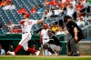 Washington Nationals' Trea Turner, left, watches his game-winning two-run home run in front of Chicago White Sox catcher Welington Castillo and umpire Bill Welke in the ninth inning of an interleague baseball game, Wednesday, June 5, 2019, in Washington. Washington won 6-4. (AP Photo/Patrick Semansky)