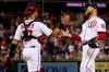 Washington Nationals catcher Yan Gomes (10) and Washington Nationals relief pitcher Sean Doolittle, right, celebrate after the Nationals defeated the Chicago Cubs 5-2 in a baseball game Saturday, May 18, 2019, in Washington. (AP Photo/Andrew Harnik)