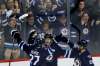 John Woods / The Canadian Press
Winnipeg Jets' Kyle Connor (81) celebrates his first NHL goal with Nikolaj Ehlers (27) and Mathieu Perreault (85) against the Dallas Stars during first period NHL hockey action in Winnipeg on Thursday, October 27, 2016.