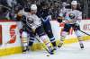 MIKE DEAL / WINNIPEG FREE PRESS
Jets defenceman Dustin Byfuglien is angled out of the play by Sabres defenceman Dmitry Kulikov during Sunday&rsquo;s game.