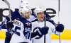 ROSS D FRANKLIN / THE ASSOCIATED PRESS
Winnipeg Jets right wing Nikolaj Ehlers (27) celebrates his goal against the Arizona Coyotes with center Mark Scheifele (55) and right wing Patrik Laine (29) during the third period.