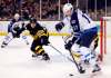 Winslow Townson / The Associated Press Files
Winnipeg Jets Adam Lowry keeps the puck from Boston Bruins defenceman Adam McQuaid in Boston on Saturday.