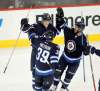 PHIL HOSSACK / WINNIPEG FREE PRESS -
Patrick Laine celebrates his power play goal Friday night with Toby Enstrom and Matthieu Perreault.