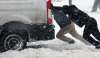 JOE BRYKSA / WINNIPEG FREE PRESS 
Cameron Batista (front) and others help push out a delivery van stuck in snow on Ellice Avenue in Winnipeg on Tuesday.