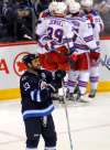 BORIS MINKEVICH / WINNIPEG FREE PRESS
Winnipeg Jets Dustin Byfuglien looks on as the New York Rangers celebrate Kevin Hayes game-winning goal in the third period, Thursday.