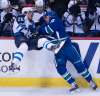 Jonathan Hayward / The Canadian Press
The second period has become a nightmare for the Jets. Tuesday, Blake Wheeler gets flattened by Jannik Hansen, while Josh Morrissey (44, on bench) looks as though he can&rsquo;t bear to watch.