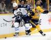 Mark Humphrey / The Associated Press
Dustin Byfuglien battles it out with Nashville Predators left winger Viktor Arvidsson during the second period. Byfuglien was in the penalty box when Nashville scored in overtime.