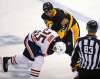 Gene J. Puskar / The Associated Press
Pittsburgh Penguins&rsquo; Ryan Reaves, right, fights with Edmonton Oilers&rsquo; Darnell Nurse in the first period of their NHL hockey game in Pittsburgh, Tuesday.