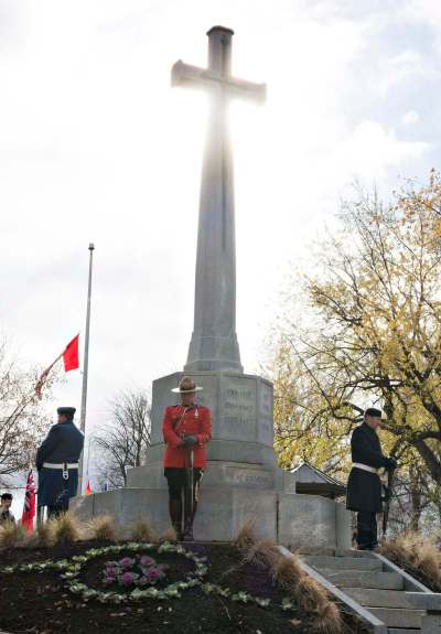 Jacques Boissinot / The Canadian Press files
Canadian Armed Forces members and a RCMP officer stand at the Sacrifice Cross during a Remembrance Day ceremony Friday, November 11, 2016 in Quebec City.