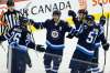THE CANADIAN PRESS/John Woods
Winnipeg Jets right wing Blake Wheeler centre Mark Scheifele, left wing Shawn Matthias and defenceman Tyler Myers celebrate Wheeler's goal against the Pittsburgh Penguins during first period of their game in October. Opposing head coaches around the NHL are taking notice of the Jets' abilities to play a heavy game with a skilled, speedy lineup.