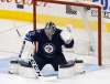 JOHN WOODS / THE CANADIAN PRESS
A New Jersey Devils shot gets past Winnipeg Jets goaltender Connor Hellebuyck (37), but hits the crossbar during the first period NHL action in Winnipeg on Saturday, November 18, 2017.