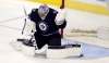Winnipeg Jets goalie Connor Hellebuyck (37) saves the puck during third period NHL hockey action against the Minnesota Wild, in Winnipeg, Monday, November 27, 2017. THE CANADIAN PRESS/Trevor Hagan