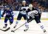 Winnipeg Jets defenseman Tyler Myers (57) skates past teammate Joel Armia (40) and Tampa Bay Lightning center Brayden Point (21) during the first period of an NHL hockey game Saturday, Dec. 9, 2017, in Tampa, Fla. (AP Photo/Chris O'Meara)
