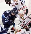 PHIL HOSSACK / WINNIPEG FREE PRESS
Winnipeg Jets' Mark Scheifele and Chicago Blackhawks captain Jonathan Toews during a faceoff Thursday at Bell MTS Place. Scheifele's faceoff percentage has jumped from 43.5 per cent last season to 52.2 per cent this season &mdash; despite battling some of the toughest centres in the league every game.