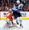 (AP Photo/Tom Mihalek)
Winnipeg Jets' Blake Wheeler in front of Philadelphia Flyers' goalie Petr Mrazek. Wheeler was one of several key players for the Jets that was watching from the press box in Montreal on Tuesday.