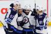 THE CANADIAN PRESS / Patrick Doyle
Winnipeg Jets players celebrate their game winning goal against the Ottawa Senators at the Canadian Tire Centre in Ottawa on Monday. The Jets returned to Winnipeg Wednesday after a raucous road trip that saw them win three out of four games.