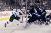 Zach Parise (11) scores on Connor Hellebuyck Wednesday night. (Trevor Hagan / Free Press files)