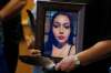 Delores Daniels holds a photo of her daughter Serena McKay who was murdered in Sagkeeng. (John Woods / The Canadian Press)