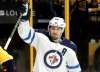 Mark Humphrey / The Associated Press
Jets centre Mark Scheifele celebrates after scoring his first goal Sunday.