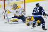 THE CANADIAN PRESS/John Woods
Winnipeg Jets' Paul Stastny's (25) shot is stopped by Nashville Predators goaltender Pekka Rinne (35) as Scott Hartnell (17) defends during first period NHL round-two game four playoff action in Winnipeg on Thursday, May 3, 2018.
