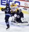 TREVOR HAGAN / THE CANADIAN PRESS FILES
The Nashville Predators&rsquo; Viktor Arvidsson takes a leap of faith to screen Winnipeg Jets goalie Connor Hellebuyck, vaulting into the air as pucks come whizzing in &mdash; and it&rsquo;s been working.