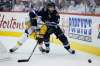 THE CANADIAN PRESS/John Woods
Nashville Predators' Roman Josi and Winnipeg Jets' Mathieu Perreault fight for the puck during playoff action in Winnipeg on Monday. Perreault knows there is a fine line between winning and losing in the playoffs.
